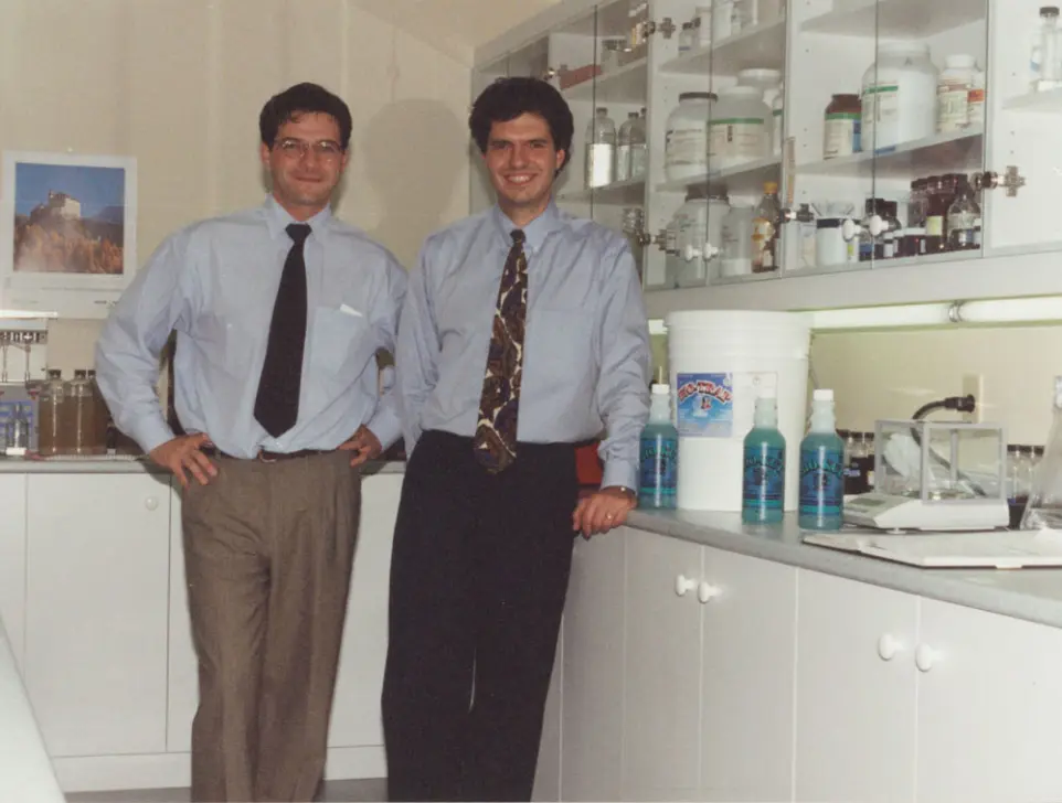 Two Canadian scientists in a laboratory in 1992, showcasing the origins of InnuScience's vision to clean differently with nature-powered solutions.